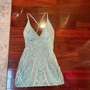 I am selling a prom dress that is a teal blue. Only wore once brand new.